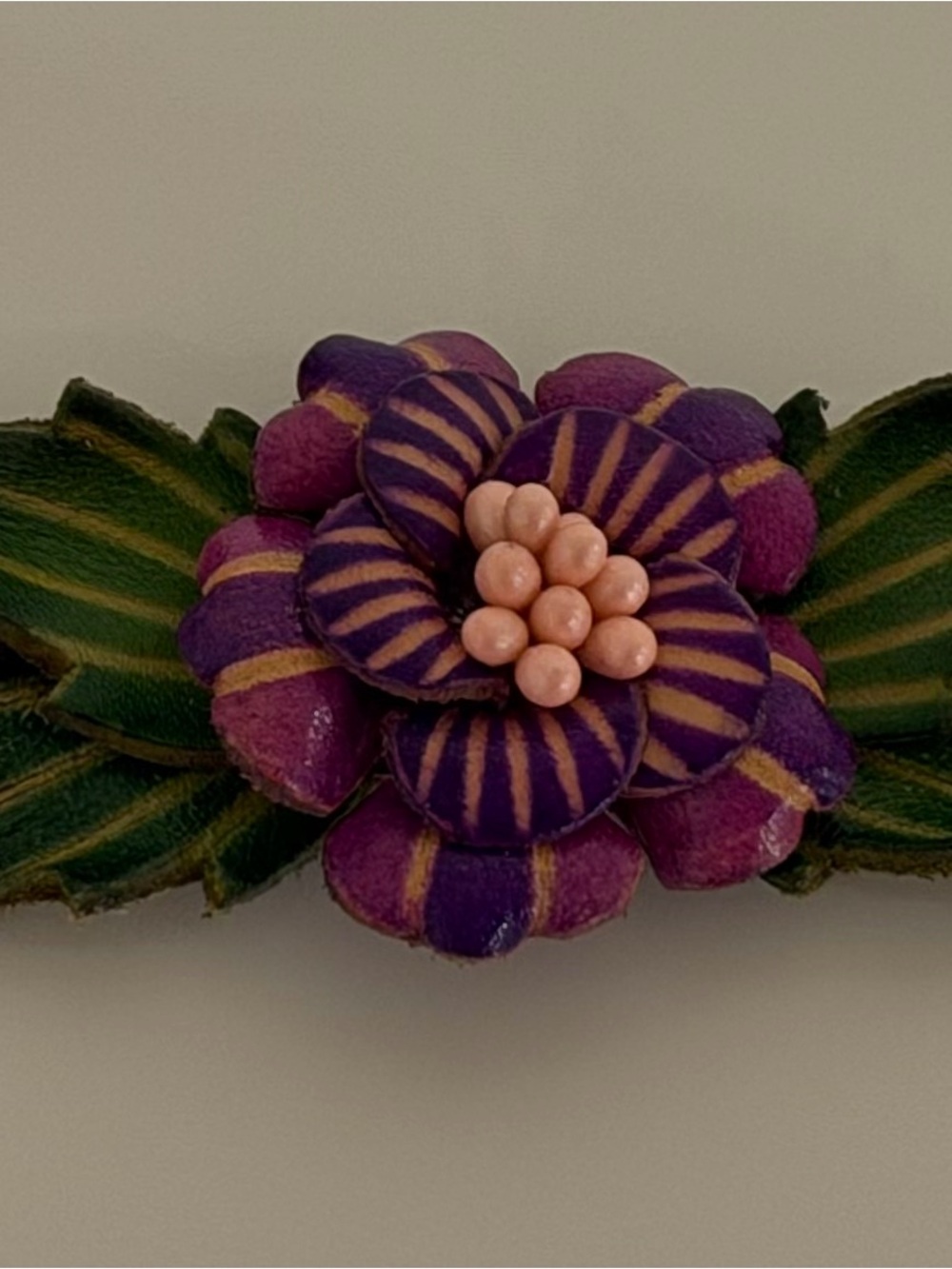 Handcrafted Purple Flower Bracelet with Green Leaves